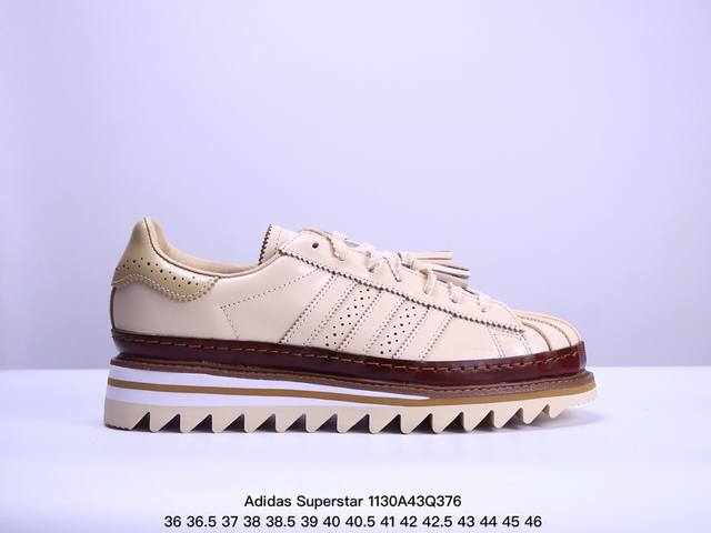 公司级clot X Adidas Superstar 陈冠希联名 锯齿休闲板鞋 鞋身整体以经典的superstar为蓝本设计将标志性的贝壳头重新演绎 鞋舌部分还